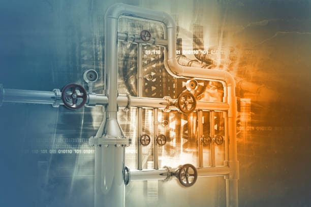 Industrial valve control system with multiple valves and pipes in a factory setting